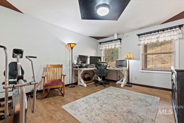 office featuring baseboards and wood finished floors