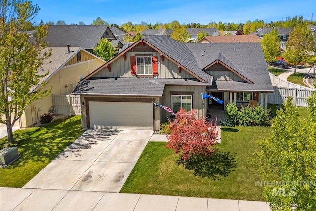 craftsman-style house with board and batten siding, concrete driveway, roof with shingles, and a residential view