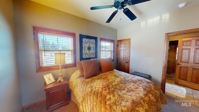 bedroom with ceiling fan and carpet flooring