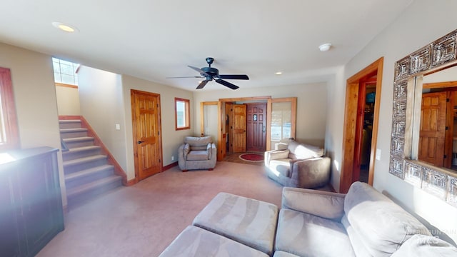 living room with light carpet and ceiling fan