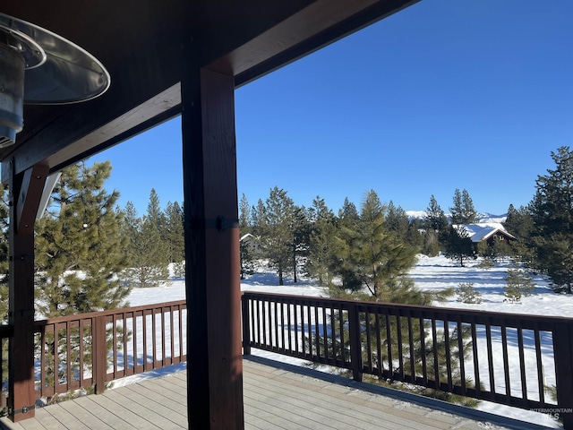 view of snow covered deck