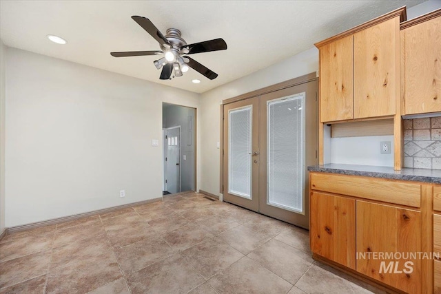 interior space with recessed lighting, french doors, ceiling fan, and baseboards