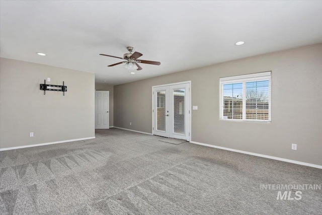 carpeted empty room with ceiling fan, french doors, recessed lighting, and baseboards