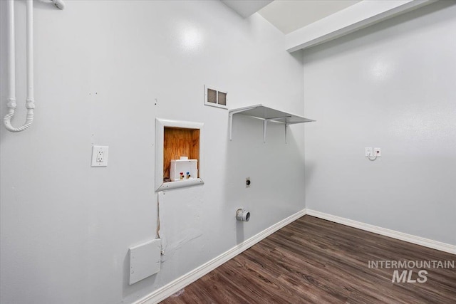 washroom with hookup for a washing machine, electric dryer hookup, wood finished floors, laundry area, and baseboards