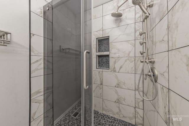 full bath with a shower stall