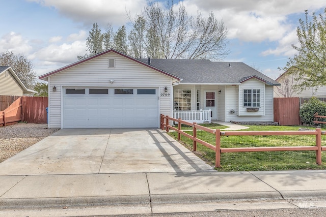 single story home with roof with shingles, a front yard, fence, an attached garage, and concrete driveway