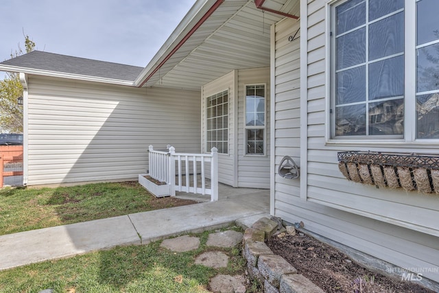 property entrance featuring covered porch