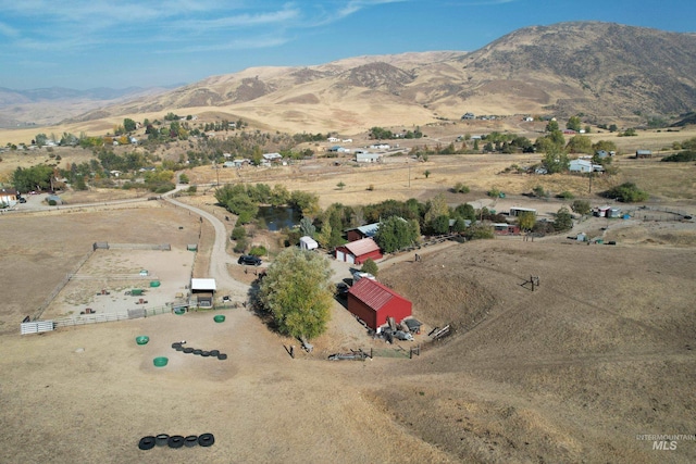 birds eye view of property featuring a rural view and a mountain view