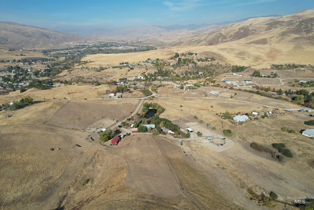 birds eye view of property with a rural view and a mountain view