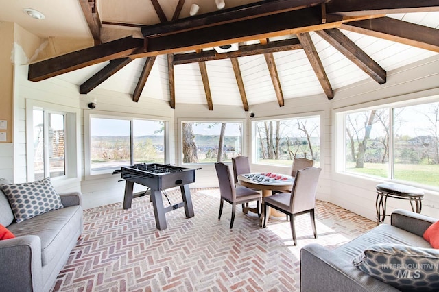 8600 W Brookside Ln, Boise, ID 83714 - sunroom / solarium with brick floor, wooden walls, lofted ceiling with beams, and a wealth of natural light