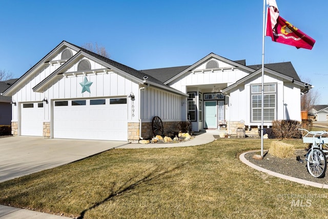 view of front of property with a garage and a front yard