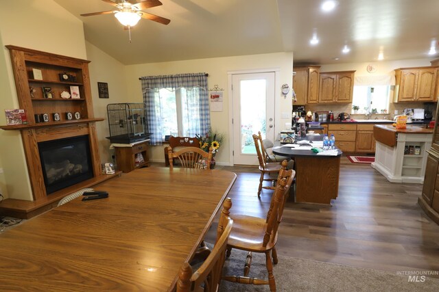 810 Pine St, Filer, ID 83328 - dining room featuring a ceiling fan, a glass covered fireplace, lofted ceiling, and dark wood finished floors