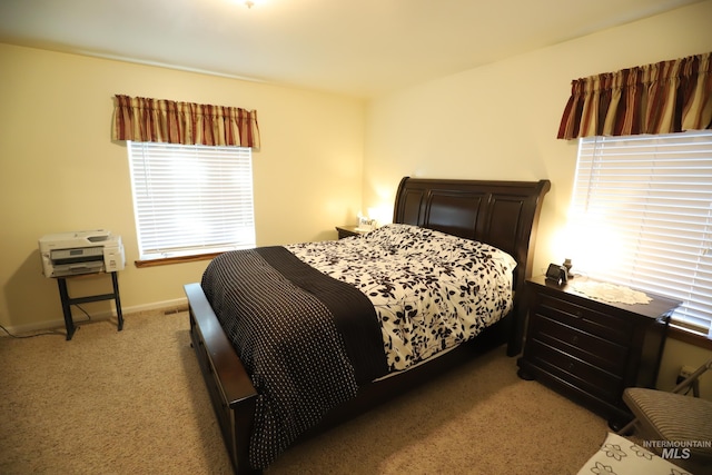 810 Pine St, Filer, ID 83328 - bedroom featuring light carpet and baseboards