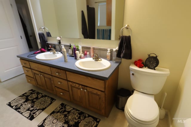 810 Pine St, Filer, ID 83328 - bathroom featuring toilet and double vanity
