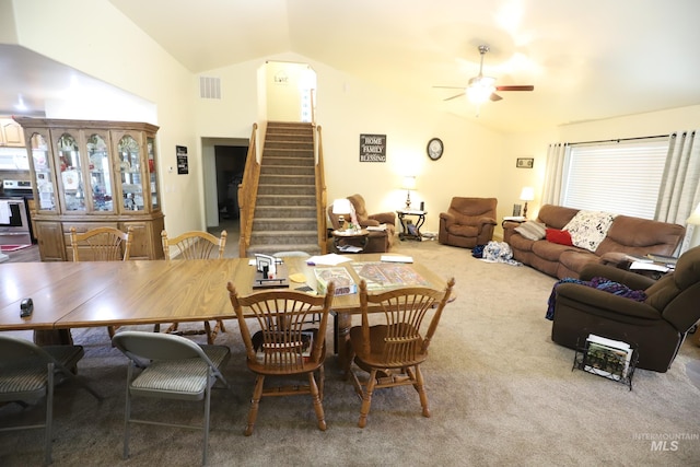 810 Pine St, Filer, ID 83328 - carpeted dining area featuring vaulted ceiling, a ceiling fan, and stairway