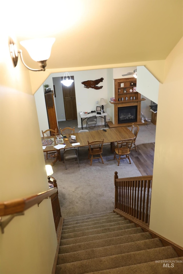 810 Pine St, Filer, ID 83328 - staircase with carpet floors and a glass covered fireplace