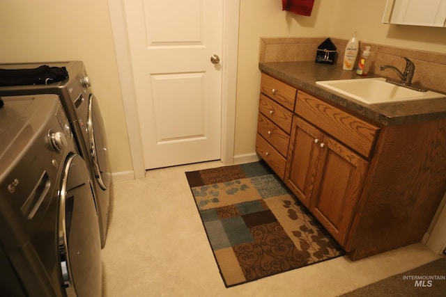 810 Pine St, Filer, ID 83328 - laundry room featuring washer and clothes dryer and cabinet space