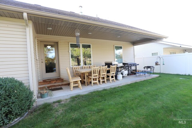 810 Pine St, Filer, ID 83328 - rear view of property with roof with shingles and a patio