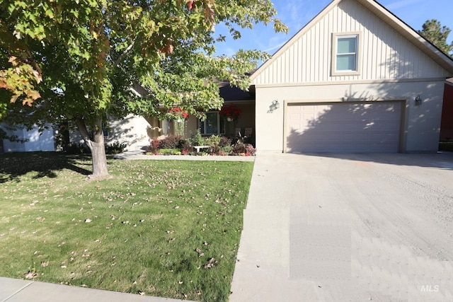 810 Pine St, Filer, ID 83328 - view of front of home with a front lawn, driveway, and board and batten siding