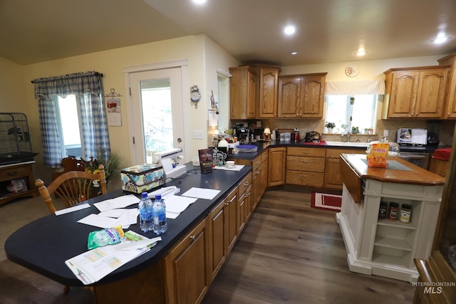 810 Pine St, Filer, ID 83328 - kitchen featuring open shelves, healthy amount of natural light, dark wood finished floors, recessed lighting, and brown cabinets
