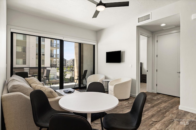3928 E Haystack St Unit 2-208, Boise, ID 83716 - dining area featuring dark wood finished floors, ceiling fan, and baseboards