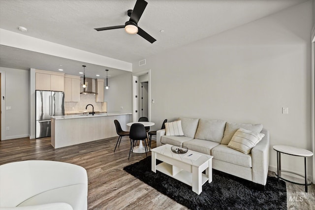 3928 E Haystack St Unit 2-208, Boise, ID 83716 - living area featuring ceiling fan, dark wood-type flooring, and recessed lighting