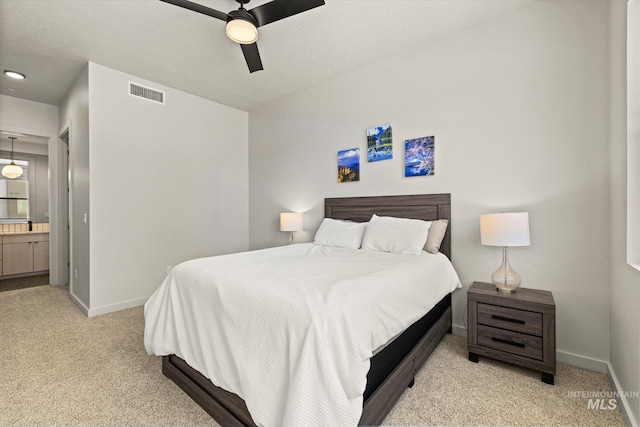 3928 E Haystack St Unit 2-208, Boise, ID 83716 - carpeted bedroom featuring baseboards, ensuite bathroom, and a ceiling fan