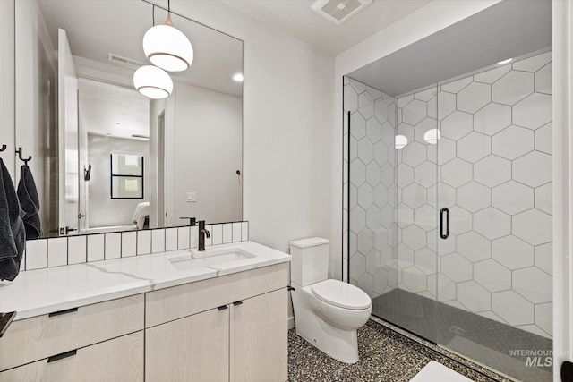 3928 E Haystack St Unit 2-208, Boise, ID 83716 - full bathroom with vanity, speckled floor, toilet, and a stall shower