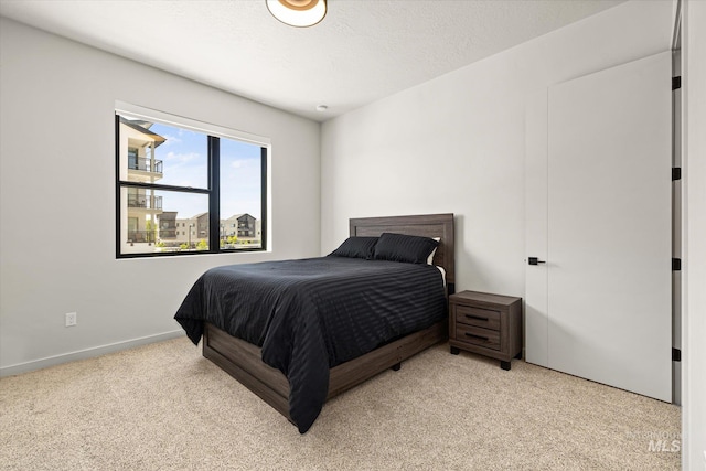 3928 E Haystack St Unit 2-208, Boise, ID 83716 - bedroom with light carpet and baseboards