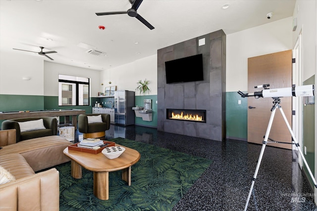 3928 E Haystack St Unit 2-208, Boise, ID 83716 - living room featuring a ceiling fan, a fireplace, and speckle patterned floor