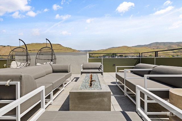 3928 E Haystack St Unit 2-208, Boise, ID 83716 - view of patio / terrace featuring an outdoor living space with a fire pit and a mountain view