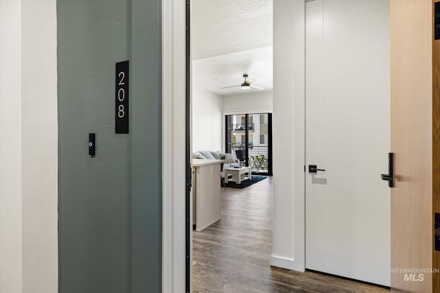 3928 E Haystack St Unit 2-208, Boise, ID 83716 - hallway with wood finished floors