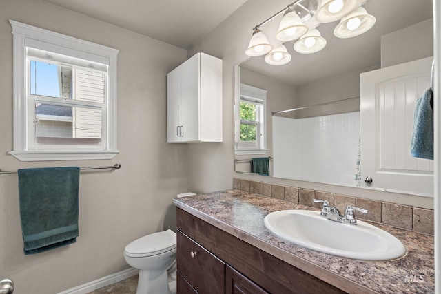 3401 S Murlo Way, Meridian, ID 83642 - full bathroom with vanity, toilet, baseboards, a chandelier, and a shower