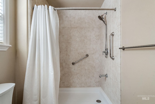 3401 S Murlo Way, Meridian, ID 83642 - full bathroom featuring a tile shower and toilet