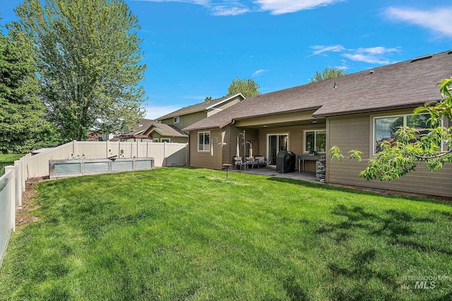 3401 S Murlo Way, Meridian, ID 83642 - back of property with a patio area and roof with shingles