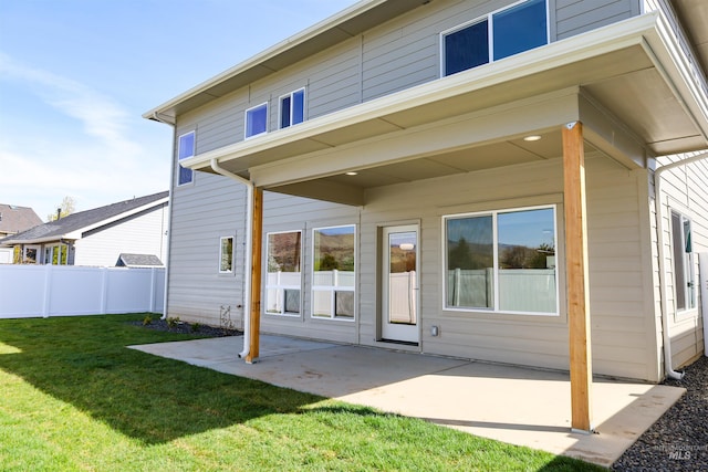 1038 E Fleetwood Ct, Boise, ID 83706 - back of property featuring fence, a patio area, and a yard