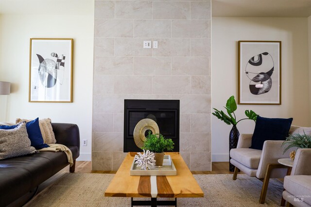 1038 E Fleetwood Ct, Boise, ID 83706 - living room with a fireplace, wood finished floors, and baseboards