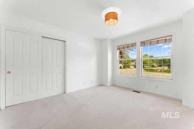 1545 N Ellington Way, Eagle, ID 83616 - unfurnished bedroom with carpet flooring, baseboards, and a closet