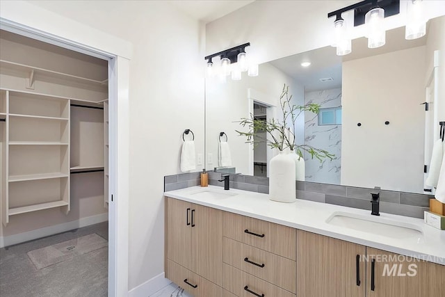 6200 S Binky Ave, Meridian, ID 83642 - bathroom featuring double vanity, baseboards, and a spacious closet