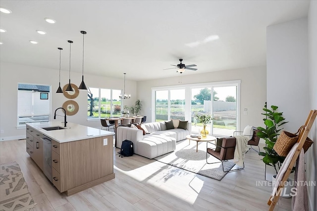 6200 S Binky Ave, Meridian, ID 83642 - living area with ceiling fan, light wood finished floors, recessed lighting, and a chandelier