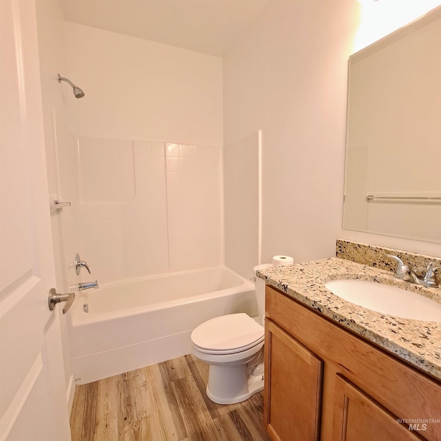 11233 W Gabrielle Dr, Boise, ID 83713 - bathroom featuring wood finished floors, toilet, vanity, and bathtub / shower combination