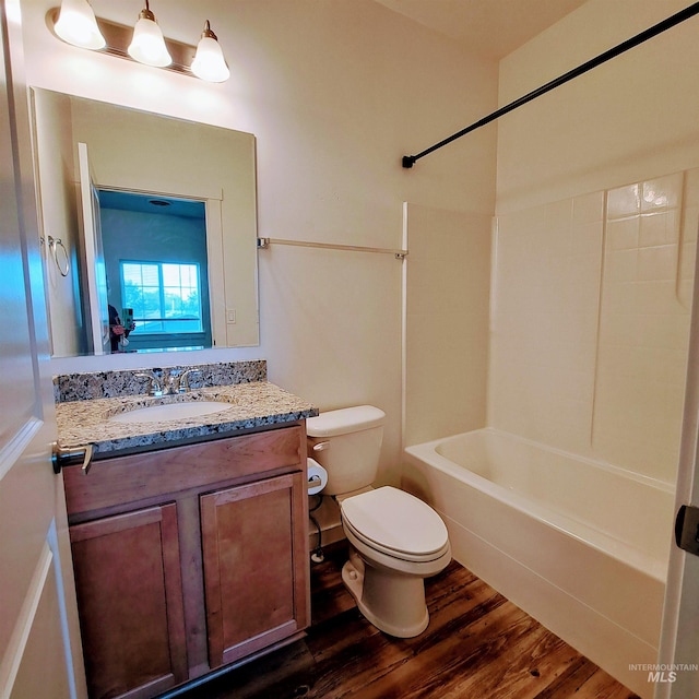 11233 W Gabrielle Dr, Boise, ID 83713 - bathroom with wood finished floors, toilet, vanity, and shower / bathtub combination