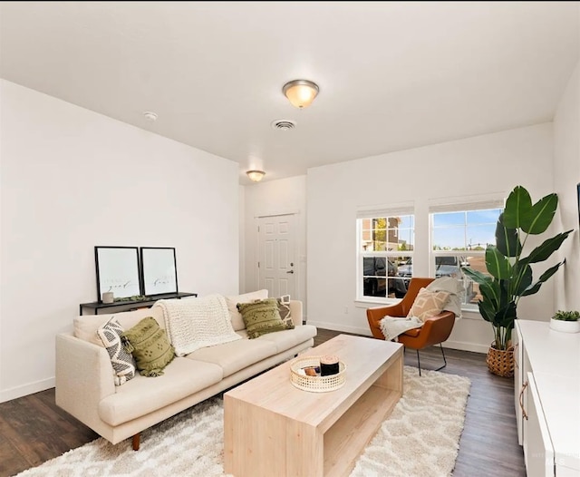 11233 W Gabrielle Dr, Boise, ID 83713 - living room featuring dark wood-type flooring and baseboards