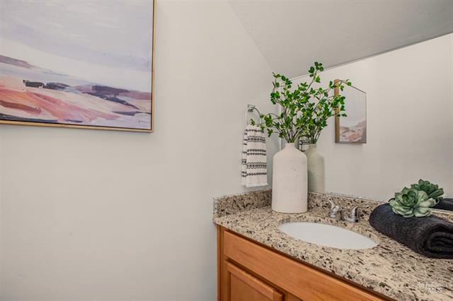 11233 W Gabrielle Dr, Boise, ID 83713 - bathroom featuring vanity and lofted ceiling