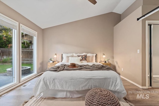 11909 W Patrina Dr, Boise, ID 83713 - bedroom featuring vaulted ceiling, wood finished floors, baseboards, and a ceiling fan