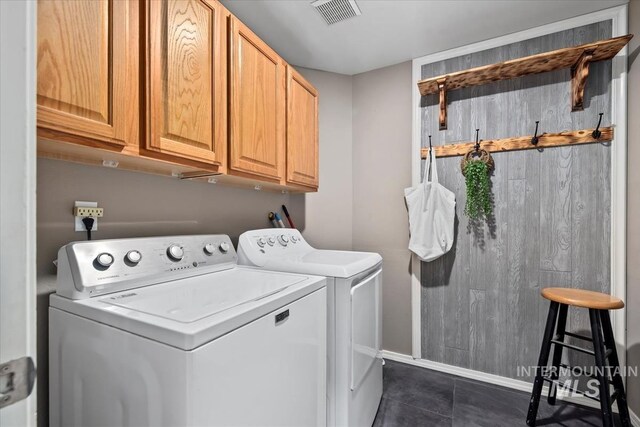 11909 W Patrina Dr, Boise, ID 83713 - laundry room with separate washer and dryer, cabinet space, dark tile patterned floors, and baseboards