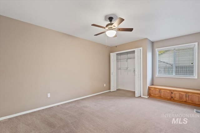 11909 W Patrina Dr, Boise, ID 83713 - unfurnished bedroom with light carpet, baseboards, a closet, and a ceiling fan