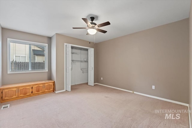 11909 W Patrina Dr, Boise, ID 83713 - unfurnished bedroom featuring light carpet, baseboards, a closet, and ceiling fan