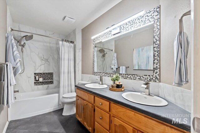 11909 W Patrina Dr, Boise, ID 83713 - bathroom with shower / bath combo, double vanity, toilet, and tile patterned floors