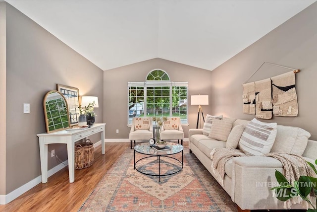 11909 W Patrina Dr, Boise, ID 83713 - living area featuring light wood-style floors, vaulted ceiling, and baseboards